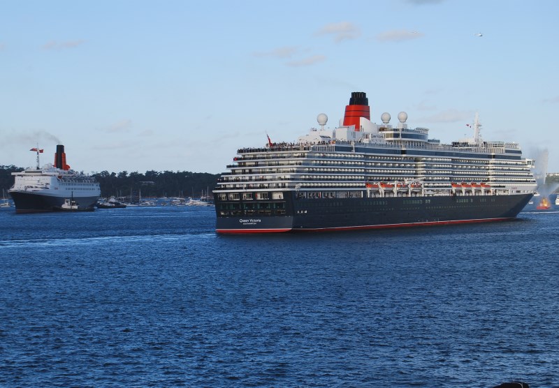 Cunard’s Queen Victoria and the Queen Elizabeth Liners passing on Sydney Harbour.