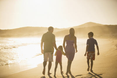 Family walking on beach at Fingal Bay, Port Stephens